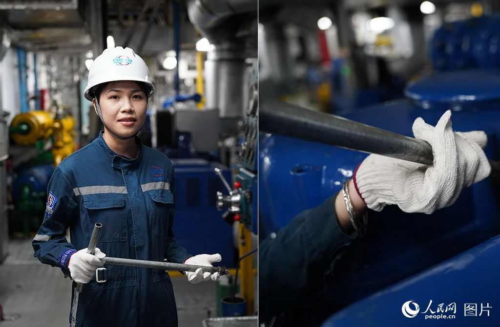 鄭樹霞正在用工具進行檢修作業。 人民網記者 孟凡盛攝