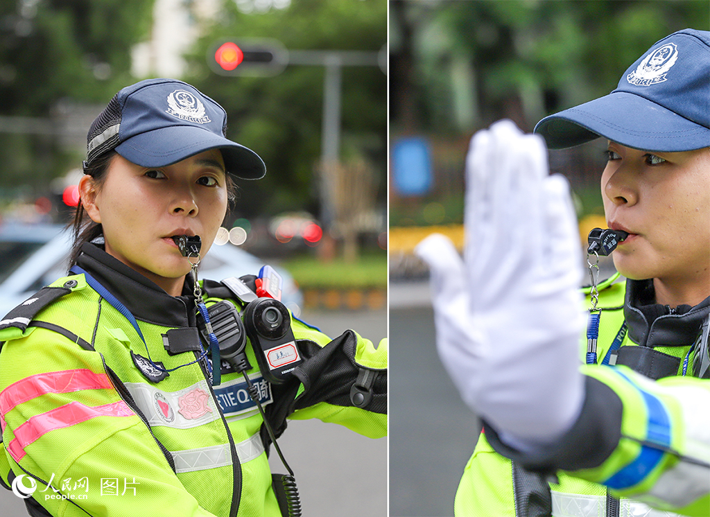 深圳市公安局交警支隊機訓大隊二中隊民警吳惠山正在路口指揮交通。人民網 王星攝
